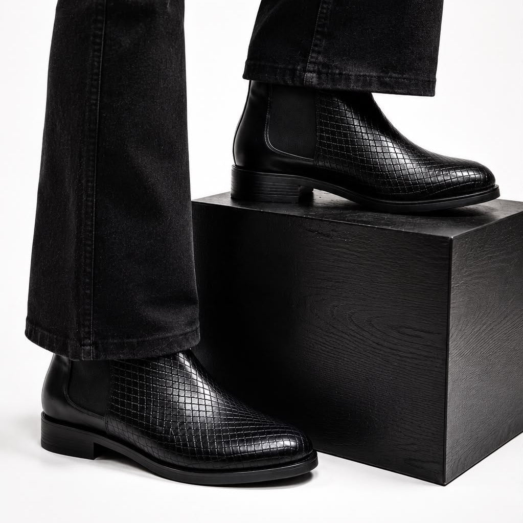 Black leather shoes on a white background